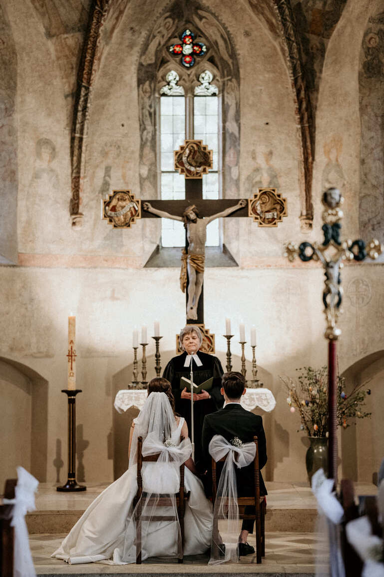 Groom and bride in church at wedding ceremony.